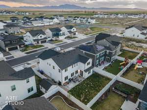 Aerial perspective of suburban area with a mountain backdrop