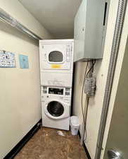 Laundry area featuring stacked washer and dryer