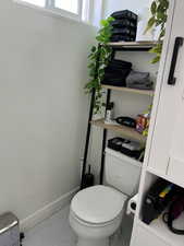 Bathroom with baseboards and light marble finish flooring
