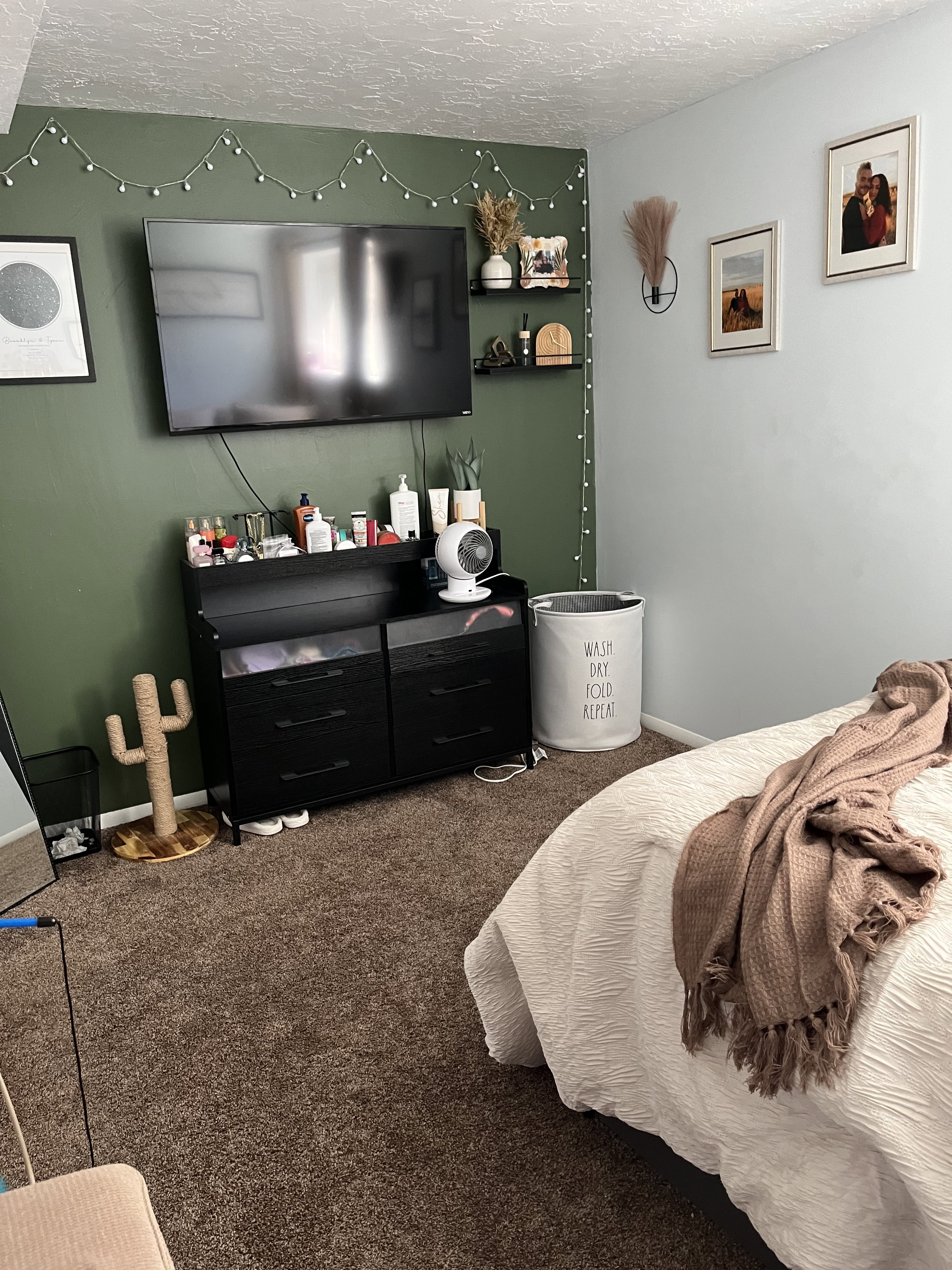 Carpeted bedroom with a textured ceiling and baseboards