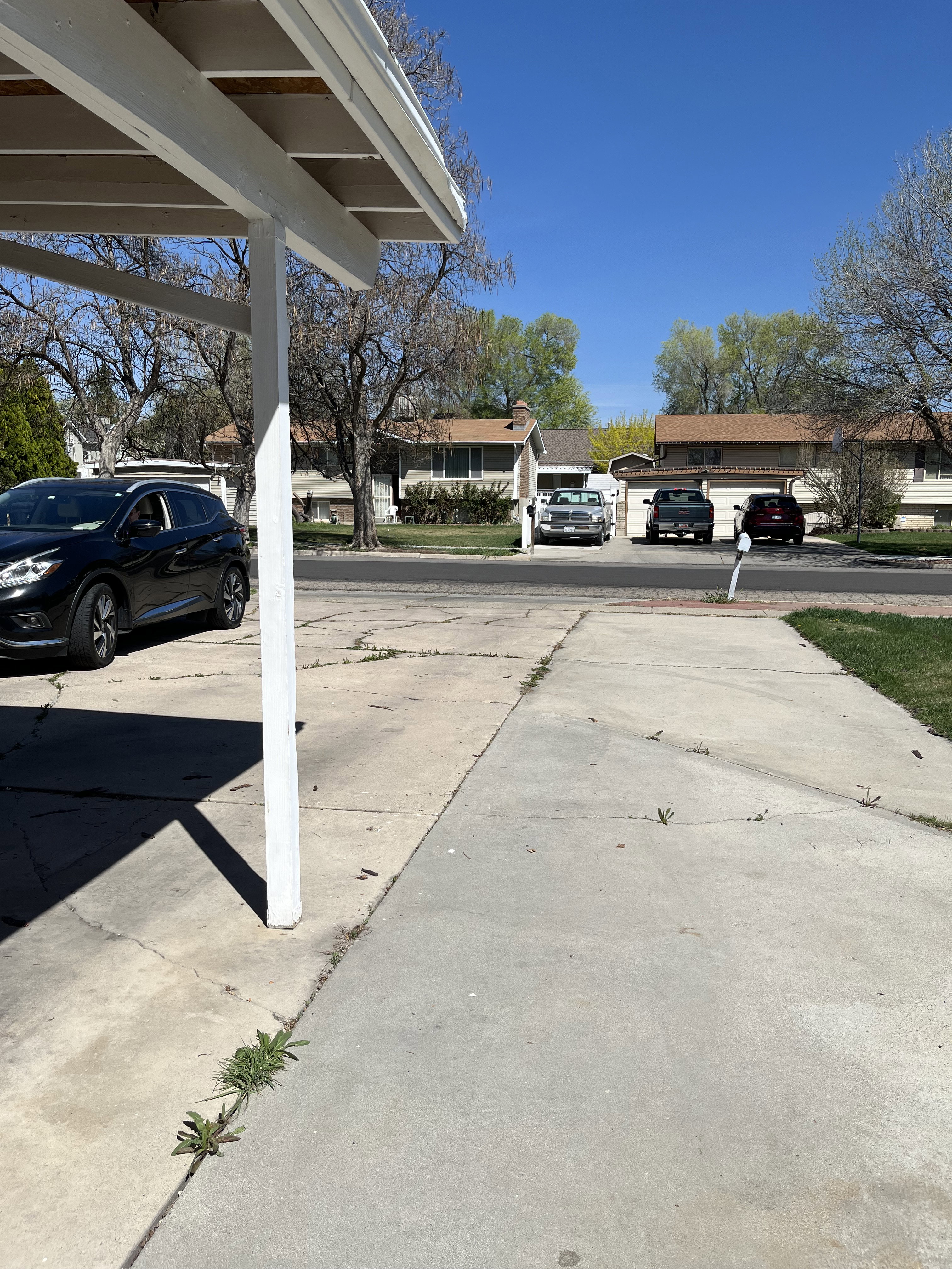 View of vehicle and RV parking featuring a residential view