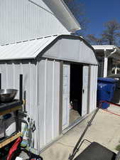 View of shed on side of house