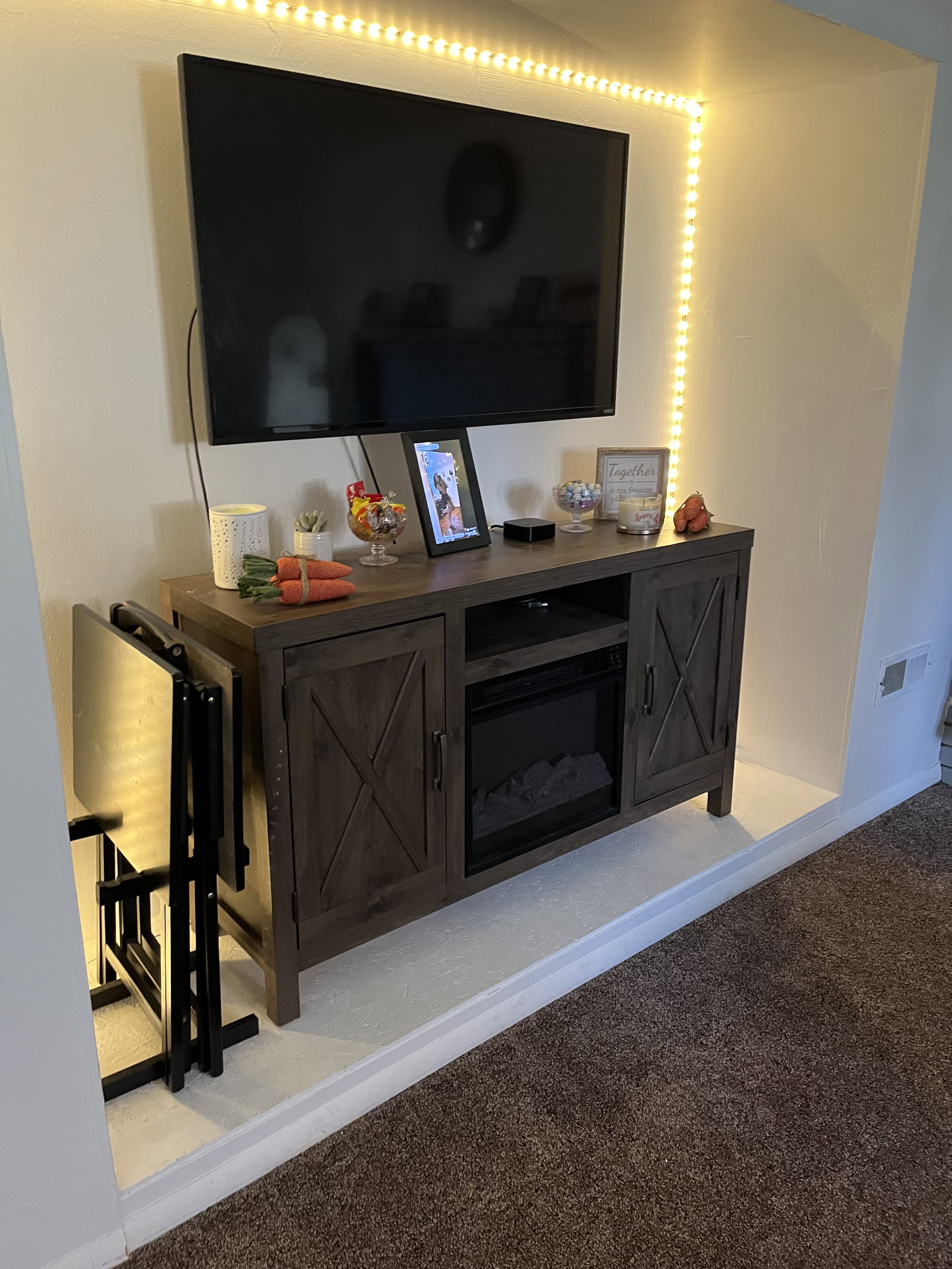 Living room showing alcove for TV/dresser