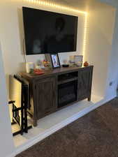 Living room showing alcove for TV/dresser