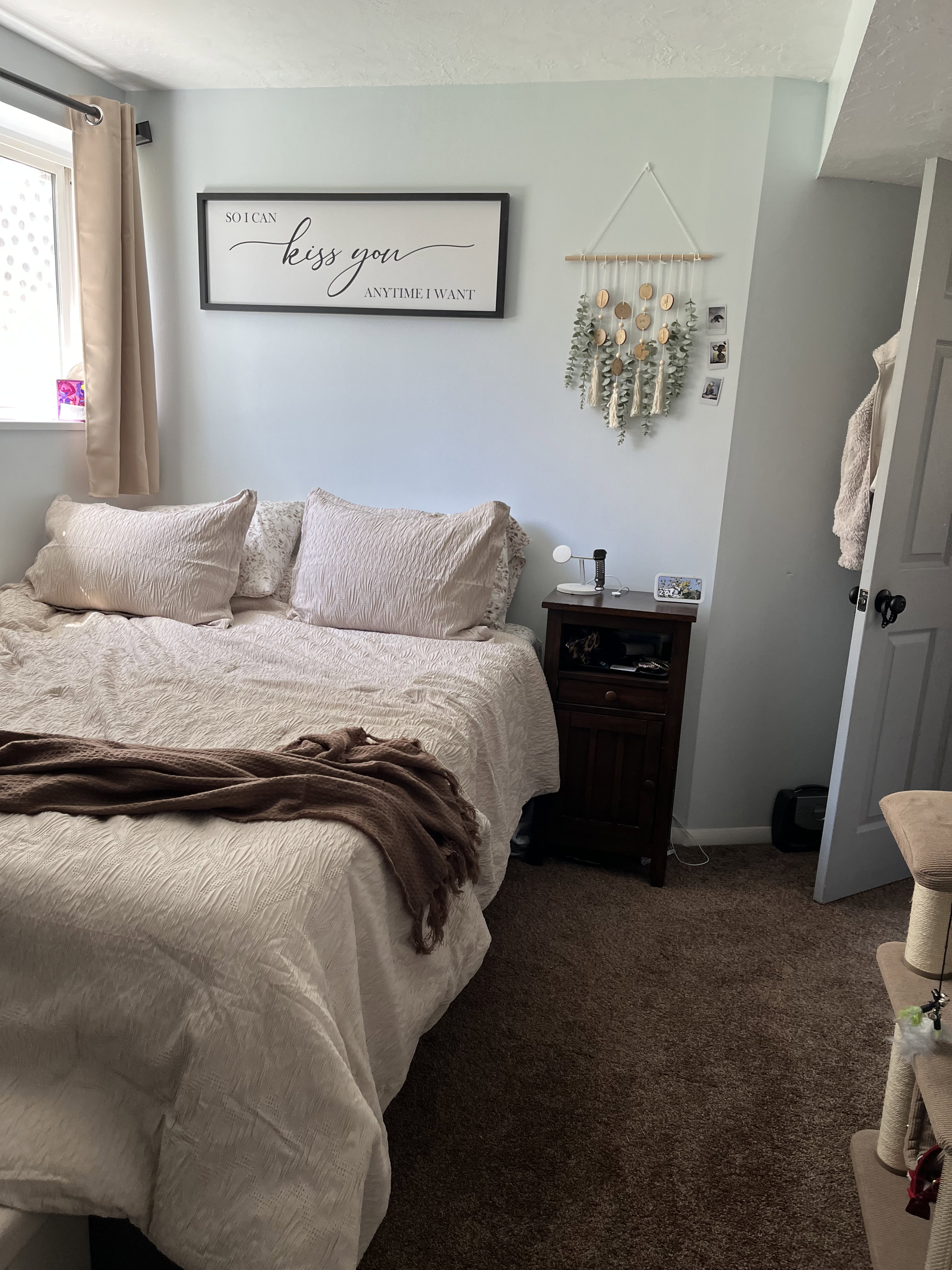 Bedroom featuring carpet floors and baseboards with walk-in closet