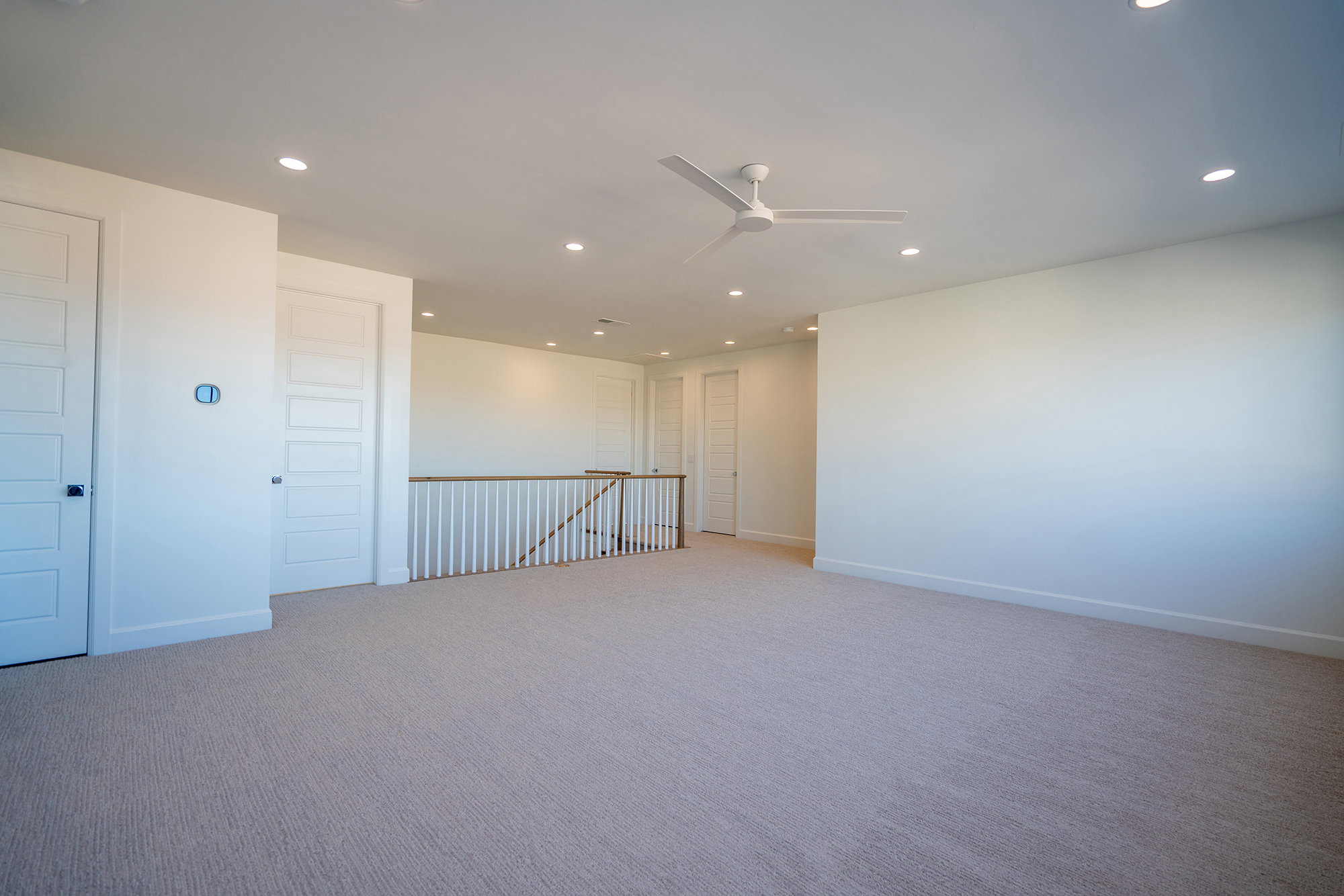 Spare room with ceiling fan, recessed lighting, and carpet flooring