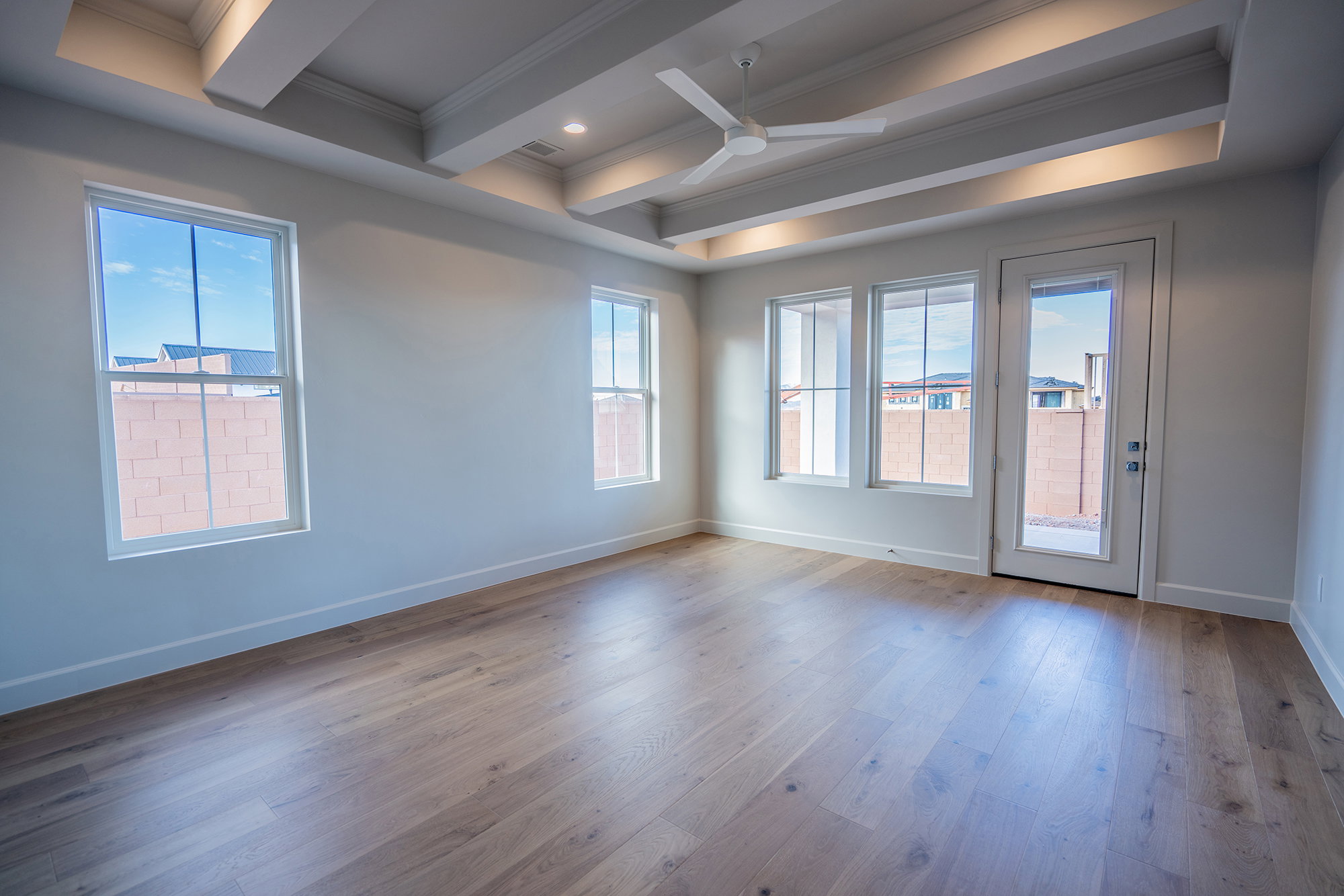 Spare room featuring a ceiling fan, dark wood-style flooring, ornamental molding, beam ceiling, and recessed lighting