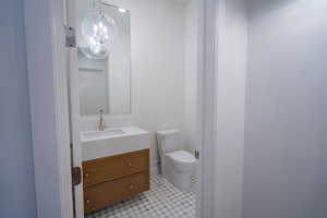 Bathroom featuring vanity and a chandelier