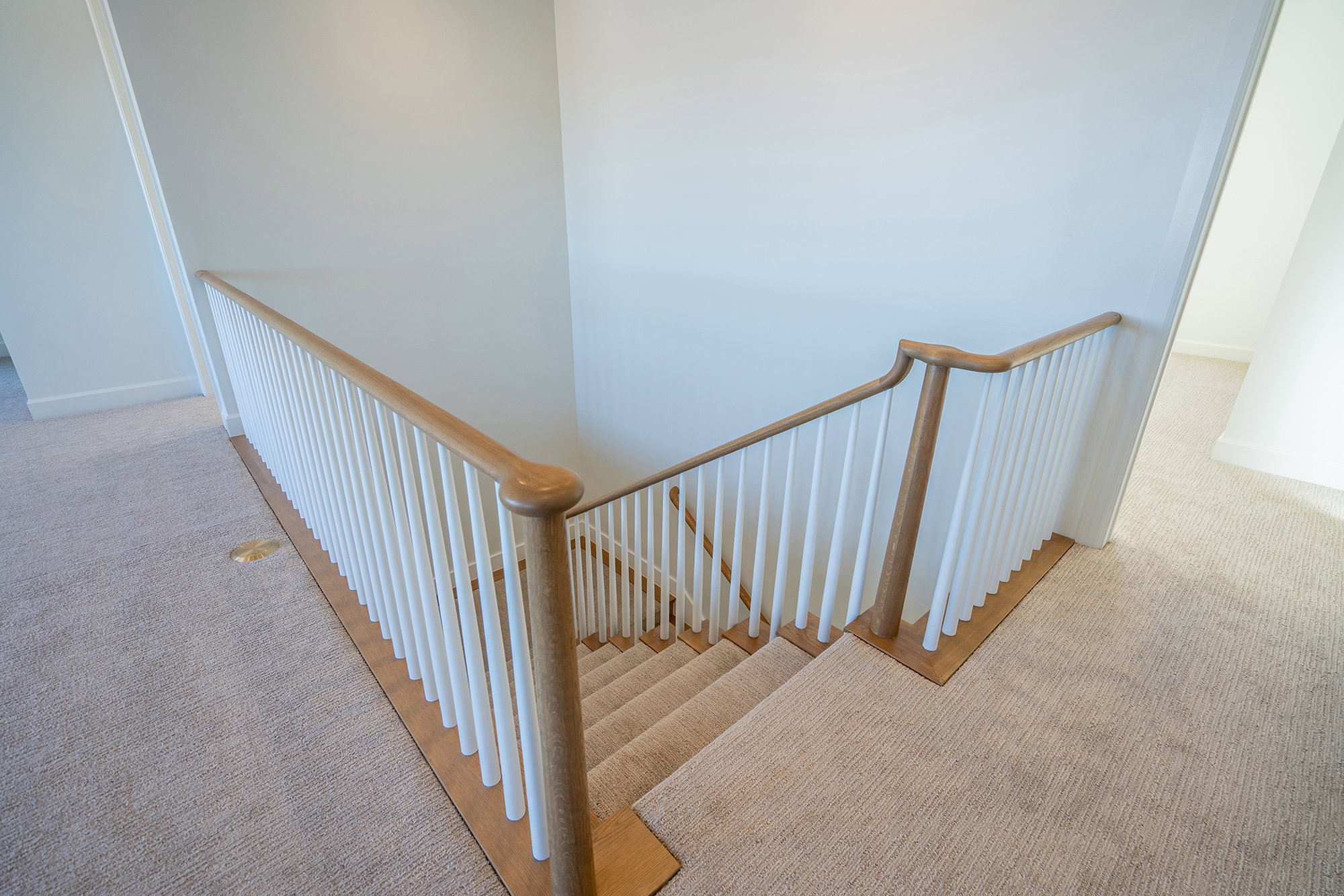 Stairway with carpet flooring and baseboards