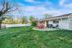 Fenced backyard featuring a patio area