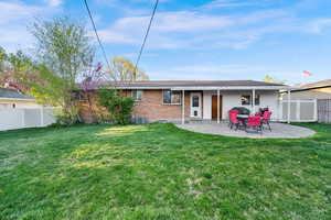 Back of house featuring a patio and brick siding