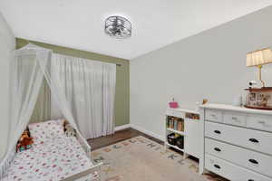 Bedroom with baseboards and light wood-style flooring