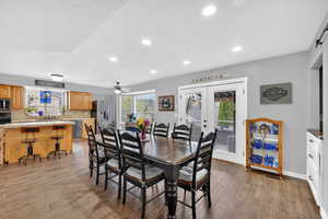 Dining room with a ceiling fan, french doors, light wood-style flooring, and recessed lighting