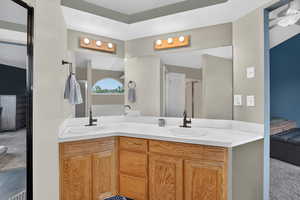 Full bathroom featuring ensuite bath, double vanity, light carpet, and a shower stall