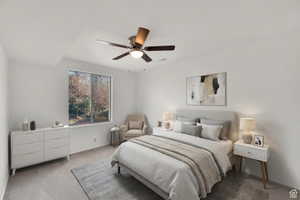 Bedroom with carpet flooring and ceiling fan and 2 closets