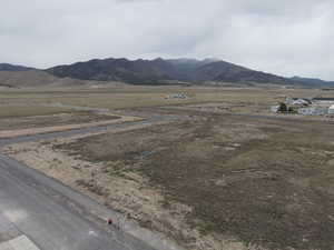 View of mountain backdrop featuring rural landscape
