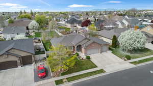 Aerial perspective of suburban area with a mountainous background