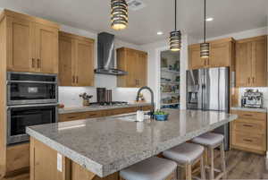 Kitchen featuring decorative backsplash, stainless steel appliances, and dark wood finished floors