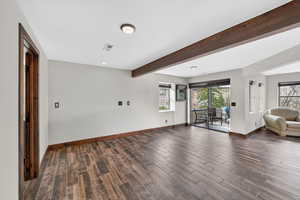 Living room with wood tiled floors, recessed lighting, and beamed ceiling