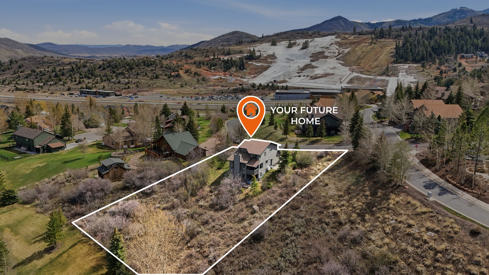 Aerial perspective of suburban area featuring mountains and property boundaries highlighted