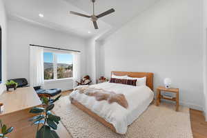 Bedroom featuring ceiling fan, recessed lighting, light wood-type flooring, and vaulted ceiling