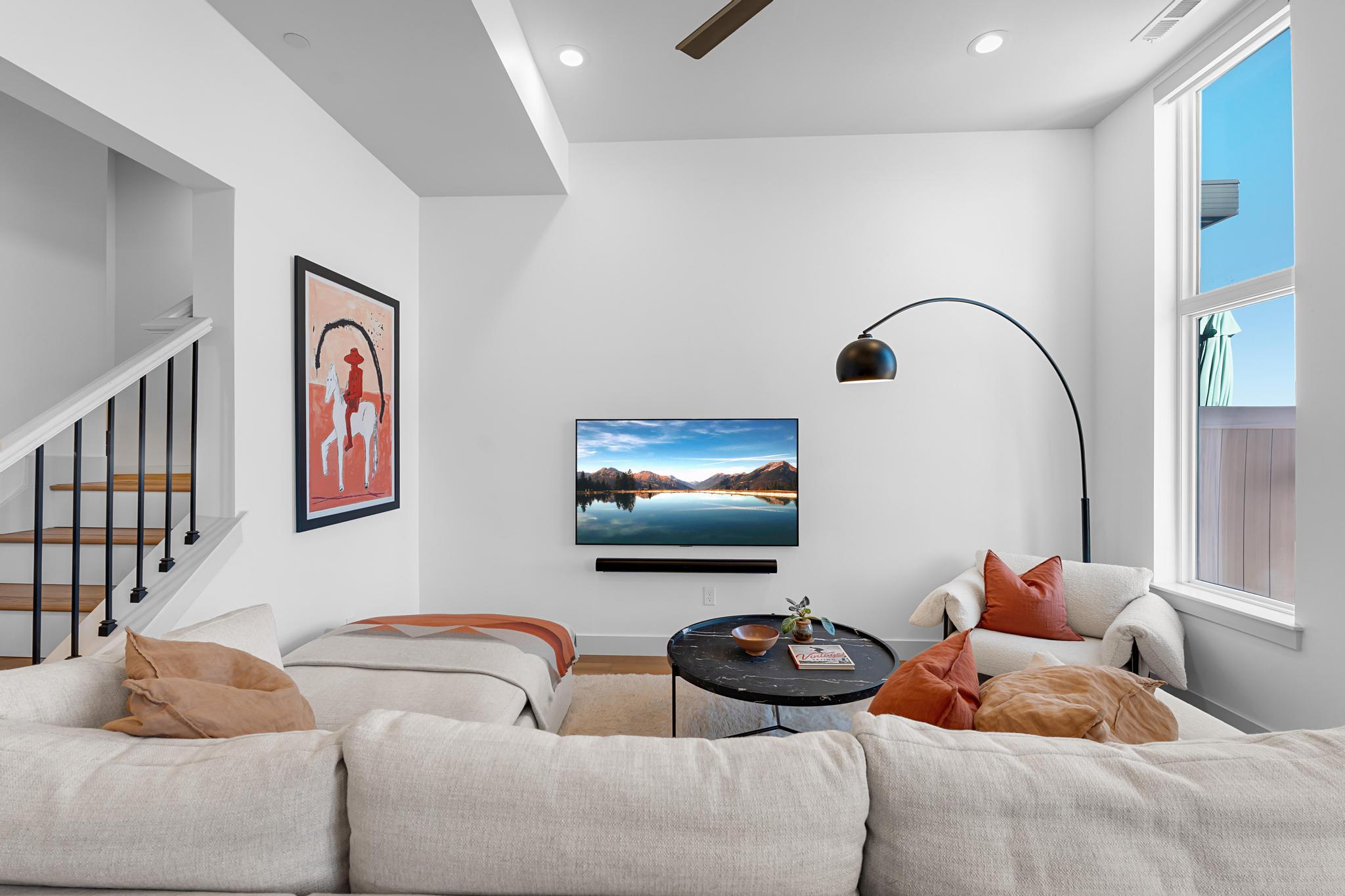 Living area featuring recessed lighting and ceiling fan