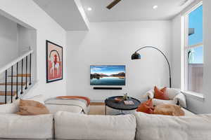 Living area featuring recessed lighting and ceiling fan