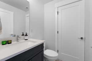 Bathroom featuring vanity and toilet