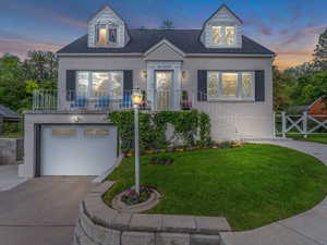 View of front of home featuring a yard, brick siding, a garage, concrete driveway, and roof with shingles