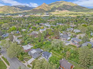 Aerial perspective of suburban area with a mountain backdrop