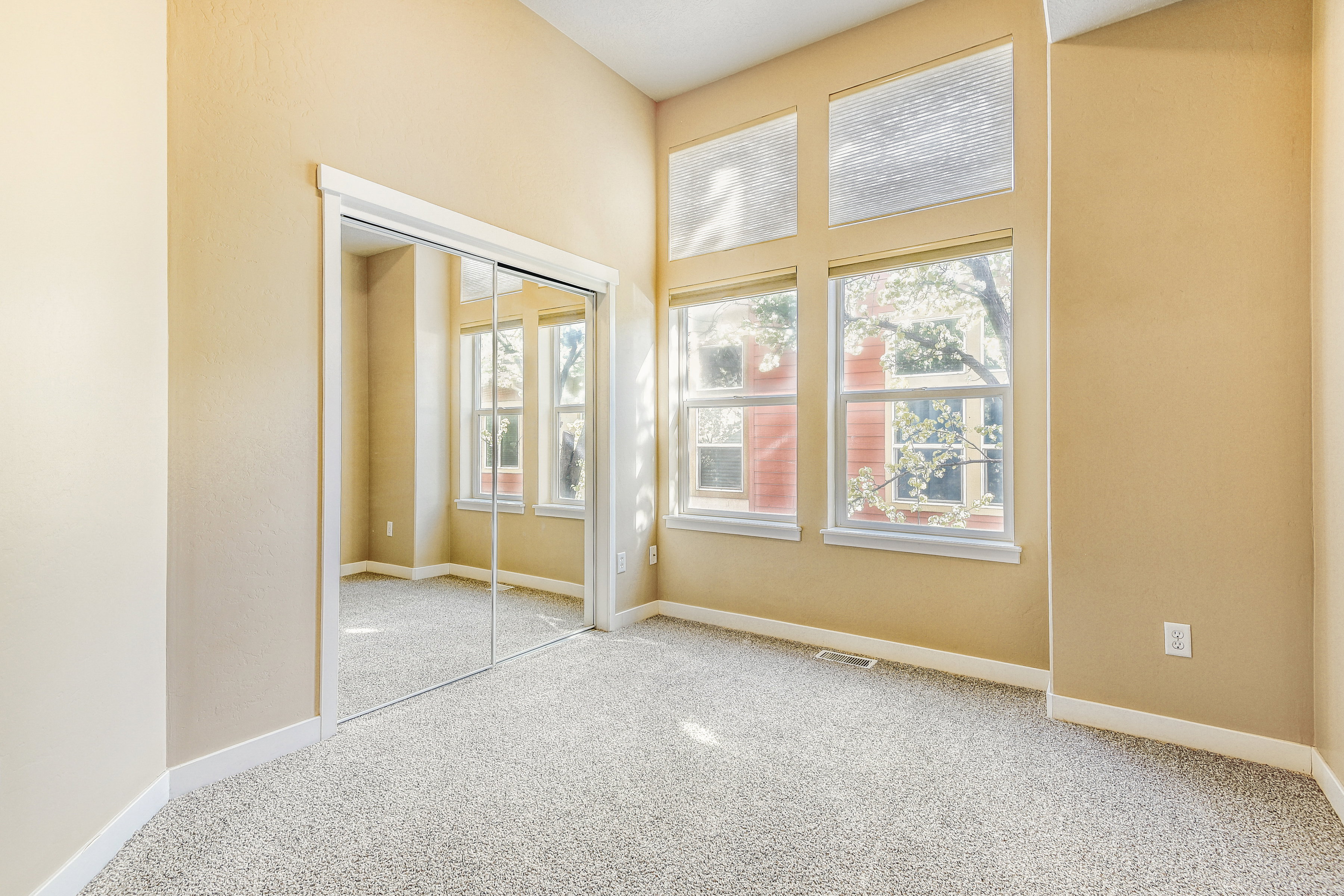 Second Bedroom w large windows and high ceilings