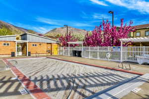 Pool area with mountain views and landscaping