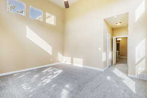 Primary Bedroom w ceiling fan and high ceiling