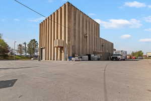 View of outdoor structure featuring a wall unit AC