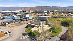 Bird's eye view of a mountain backdrop and industrial structures