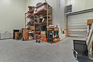 Garage featuring metal wall