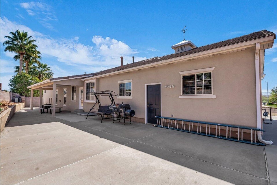 Back of house featuring stucco siding and a patio area