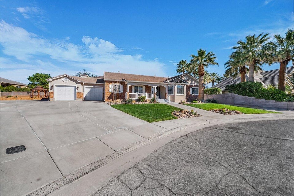 Ranch-style house featuring an attached garage and driveway