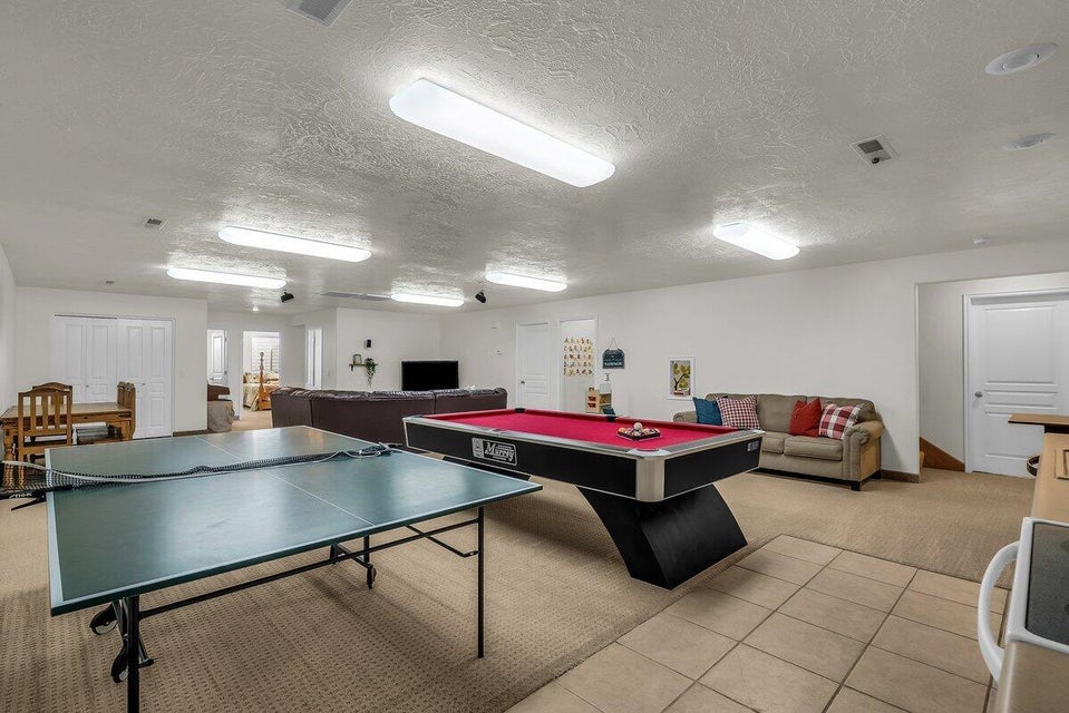 Rec room with a textured ceiling and pool table