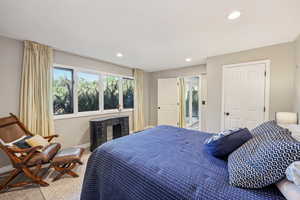 Carpeted bedroom with baseboards and recessed lighting