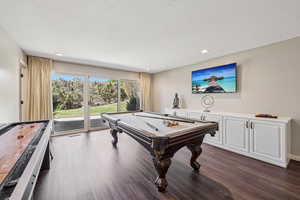 Recreation room featuring pool table, dark wood finished floors, recessed lighting, and a textured ceiling