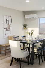Dining room featuring a mini split for heating / cooling, recessed lighting, and light wood finished floors