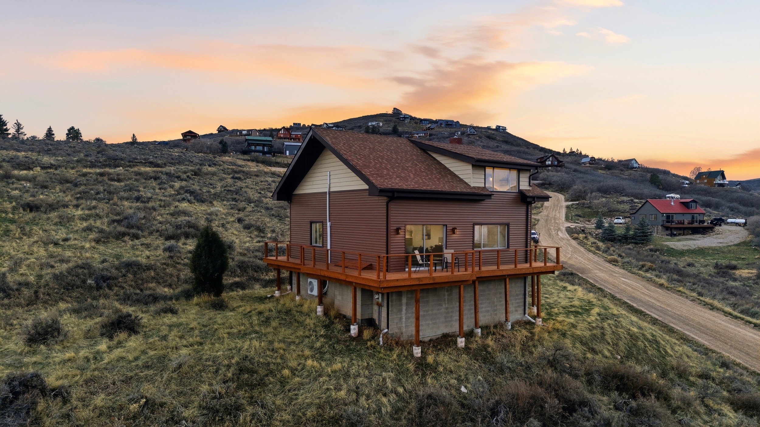 Rear view of house featuring a wooden deck