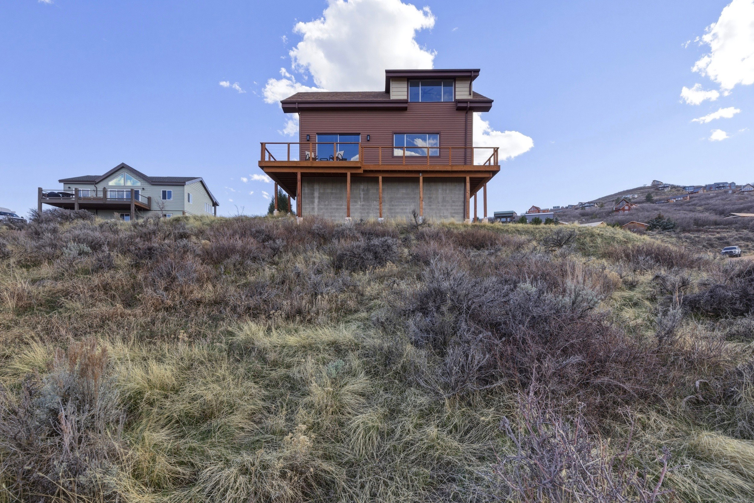 Rear view of house featuring a deck