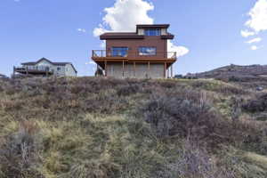 Rear view of house featuring a deck