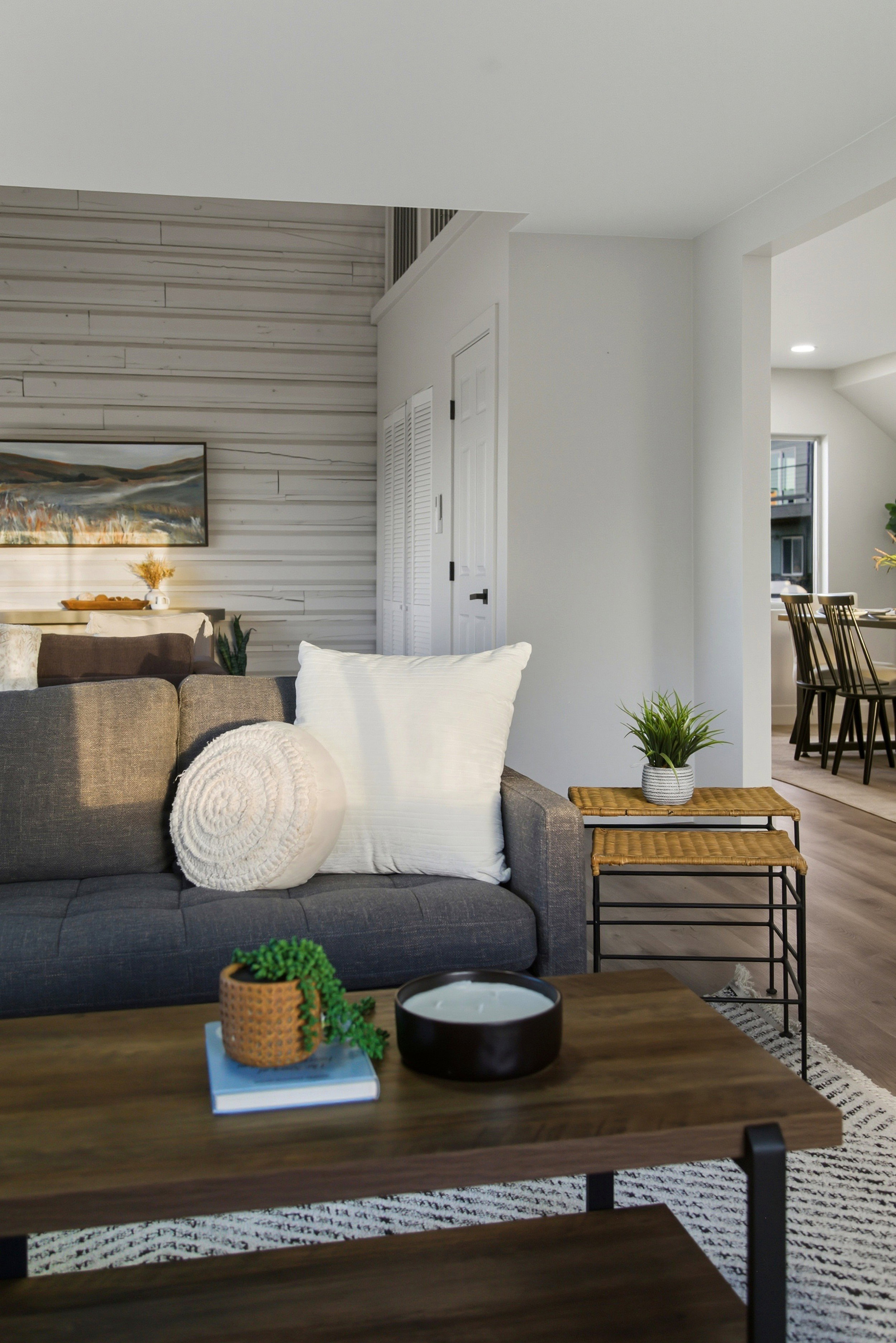 Living room featuring wood finished floors, wooden walls, and recessed lighting