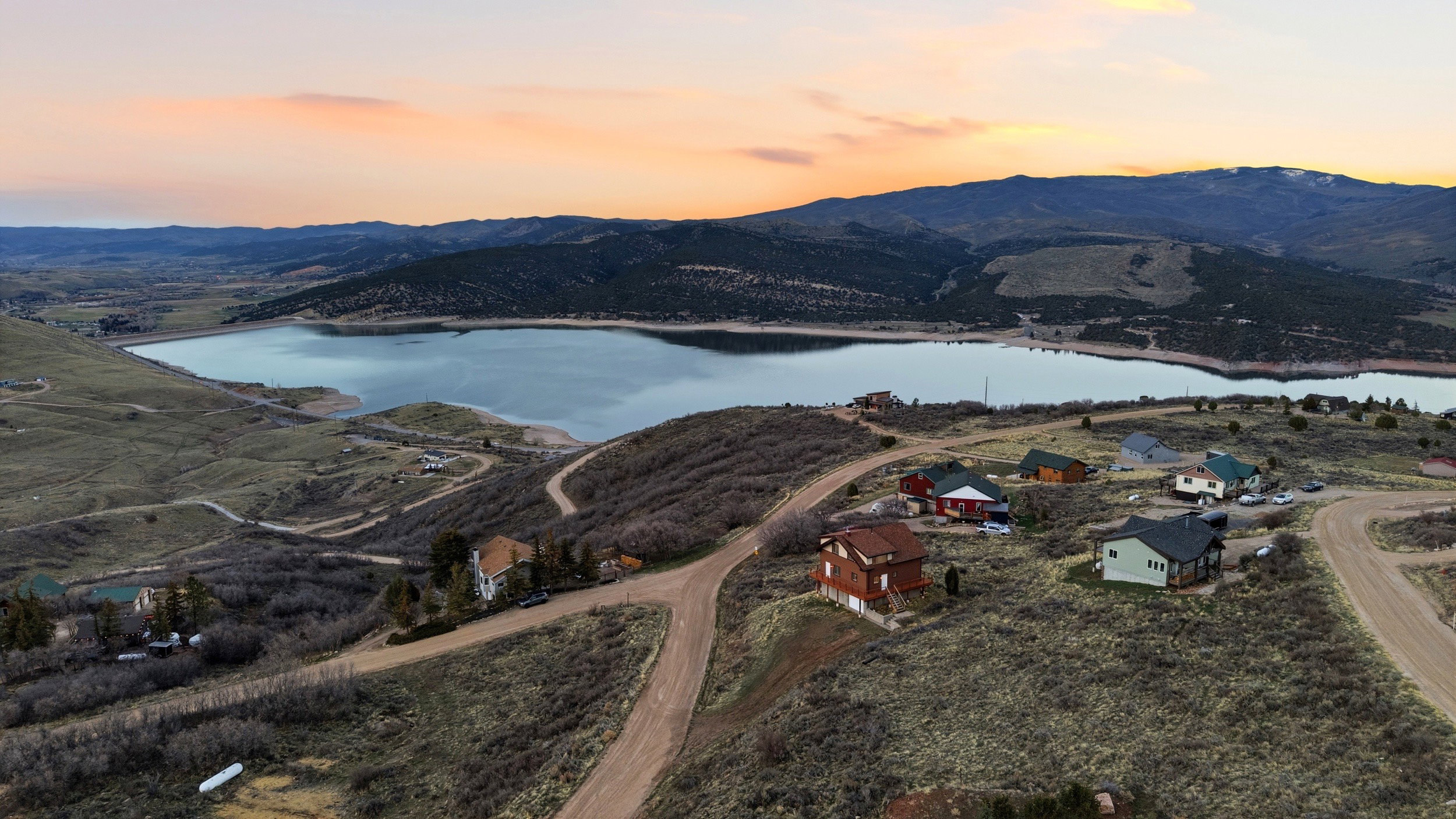 Aerial view at dusk of a water and mountain view