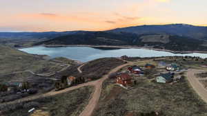 Aerial view at dusk of a water and mountain view