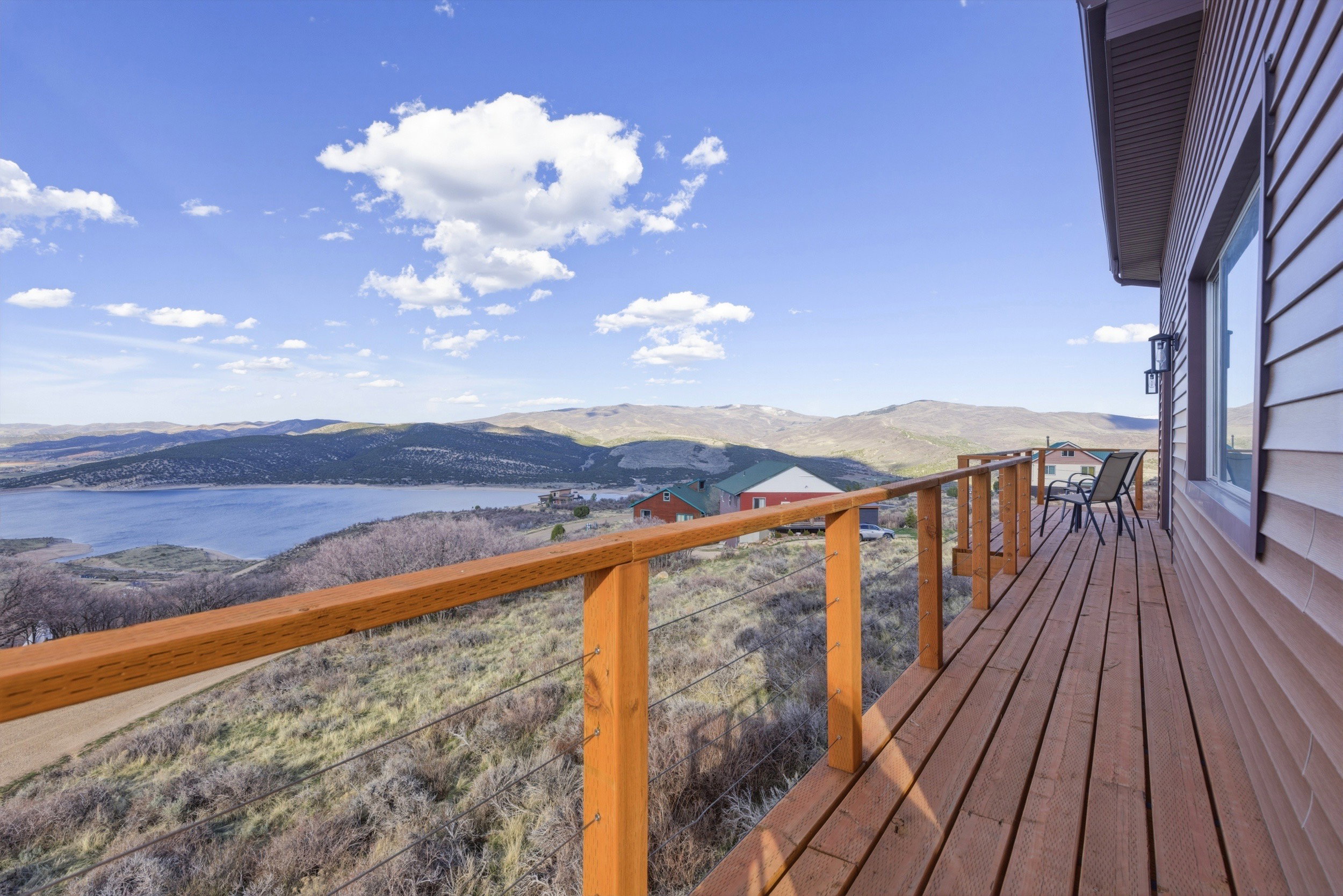 Deck featuring a water and mountain view