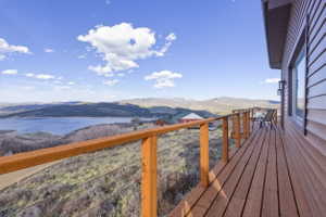 Deck featuring a water and mountain view